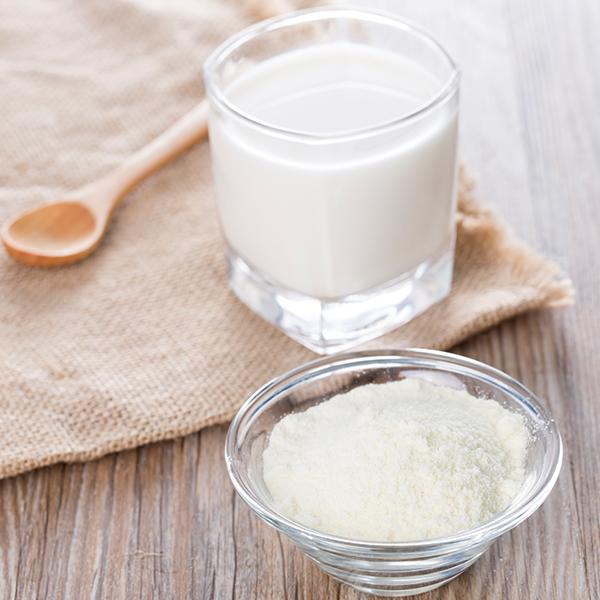 image of whole milk powder, mixed with water