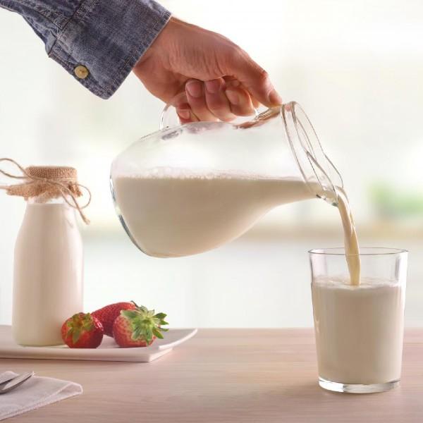 milk pouring into a glass