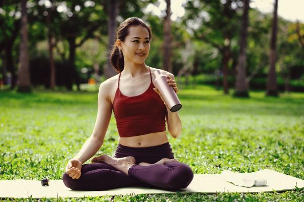 image of a woman drinking a smoothie