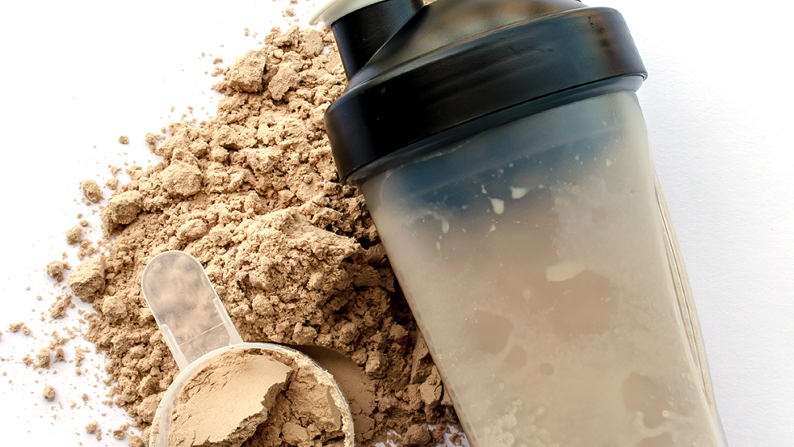 shaker and scoop of whey isolate powder