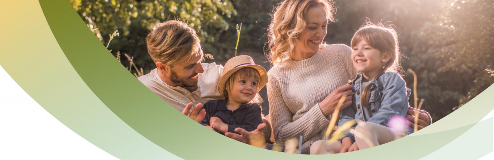 Picture of a family sitting on grass