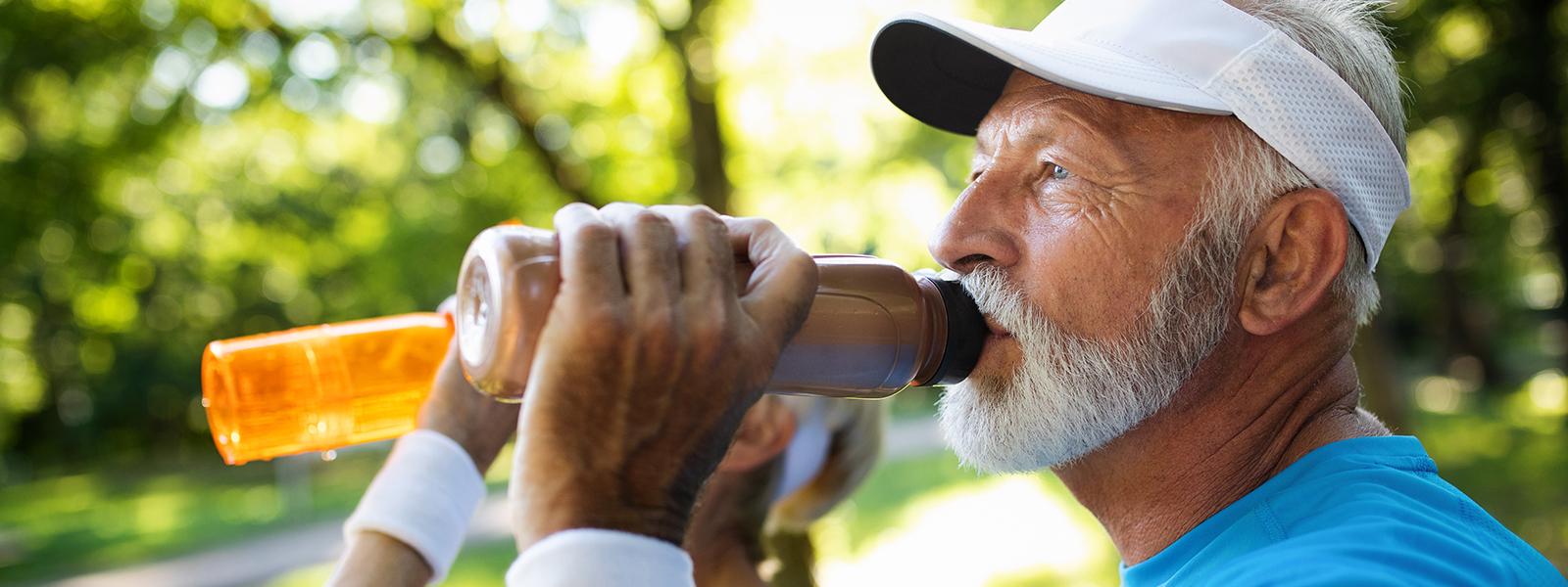 image of elderly man drinking milk protein drink